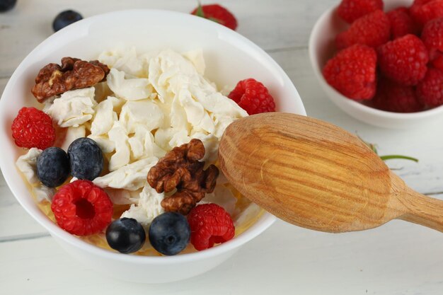 Croissant breakfast with cheese berries and nuts Hearty and healthy food