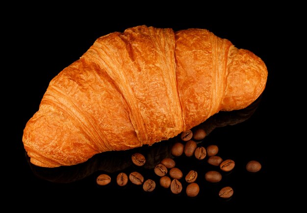 Croissant and coffee beans