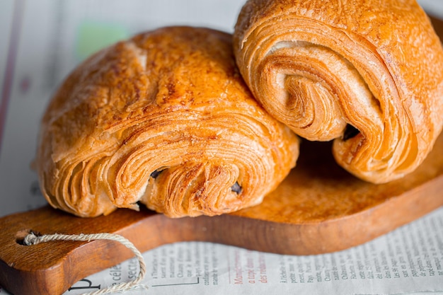 Croissant macro. French croissant with waves. Air baking. Croissant for puff pastry advertising.