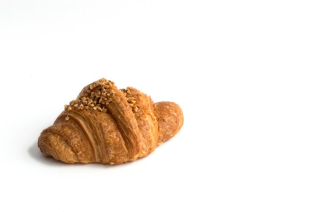 Croissant with almonds on white background