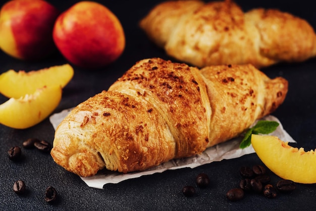 Croissant with apricots and coffee beans