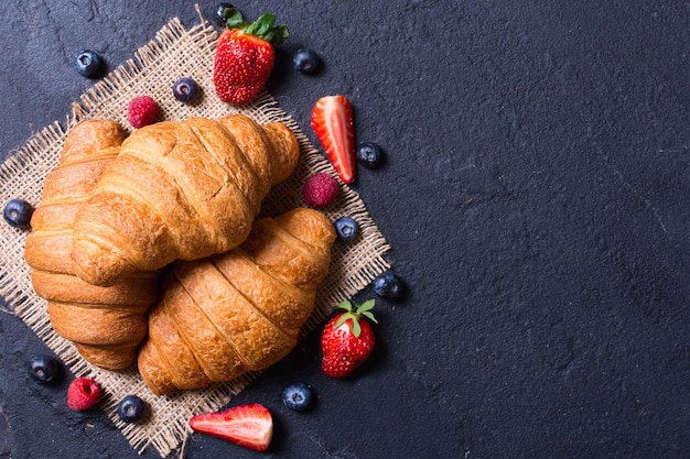 Croissant with berries blueberries raspberry and strawberry