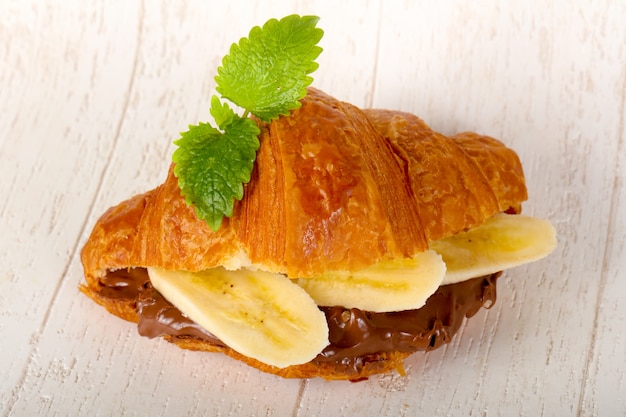 Croissant with chocolate and banana