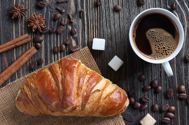 Croissant with coffee cup