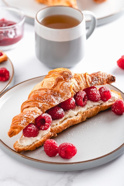 Croissant with fresh raspberries