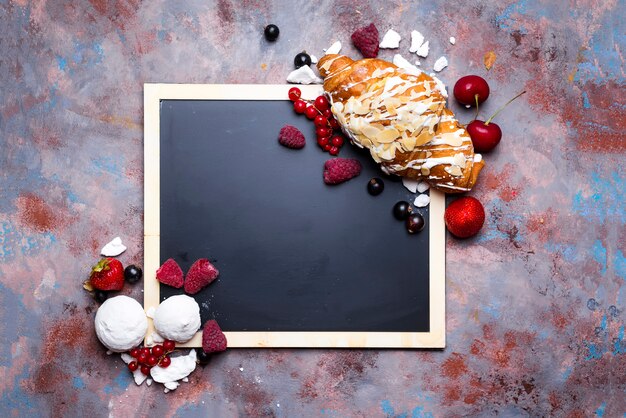 Croissant with meringue on chalkboard