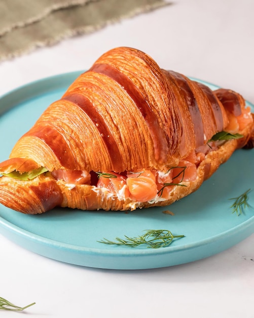 A croissant with salmon on it