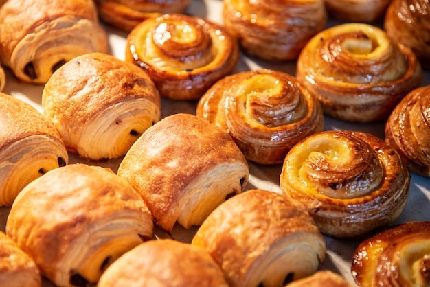 Croissants in a bakery shop. freshly baked croissants on texture background