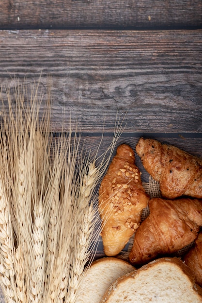 Croissants and breads on the old wooden table