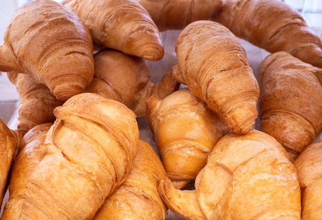 croissants on a shelf in a store