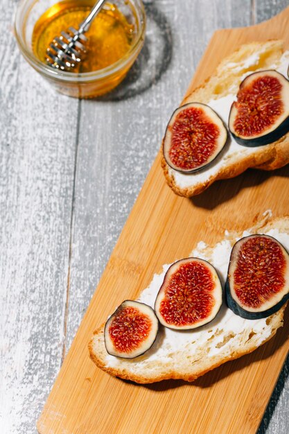 croissants with figs on a wooden background