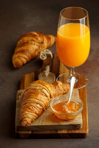 Premium Photo | Croissants with fresh orange juice