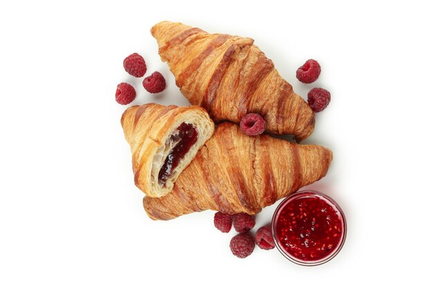 Croissants with raspberry jam isolated on white background