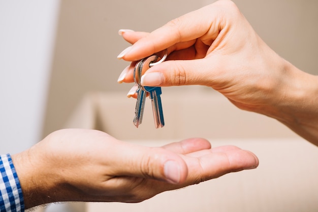 Crop agent giving keys to man