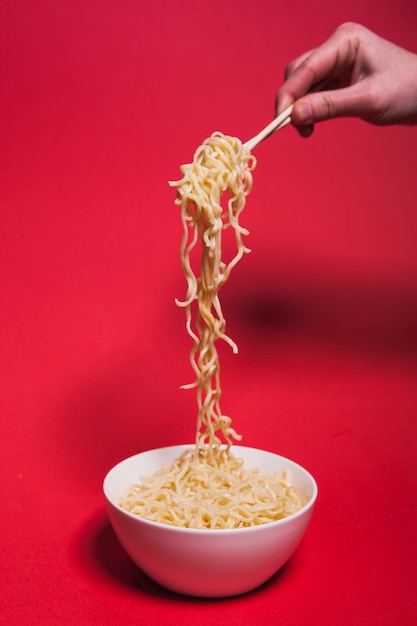 Crop hand picking noodles