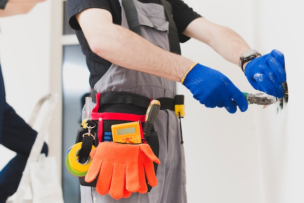 Photo crop handyman working with wires