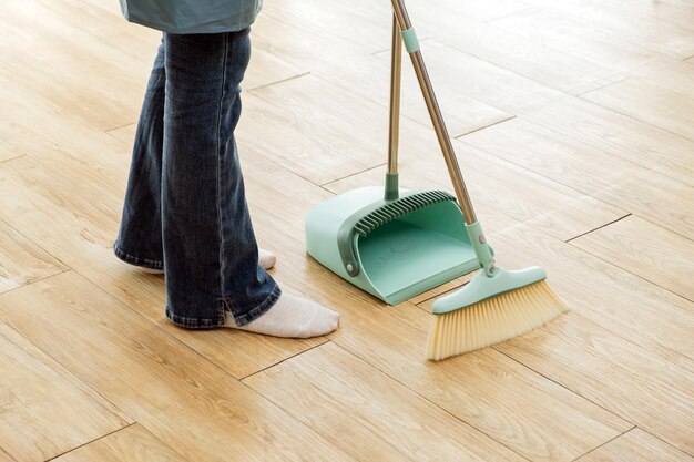 Photo crop image of a young professional cleaning service women worker working in the house