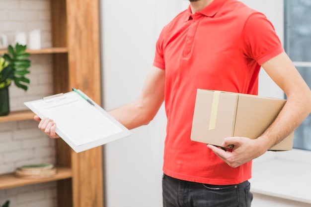 Photo crop man with clipboard and parcel