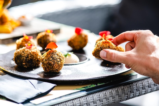 Crop person eating delicious appetizer