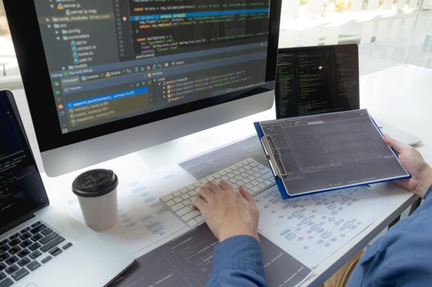 Premium Photo | Cropped hand of computer programmers brainstorming in ...