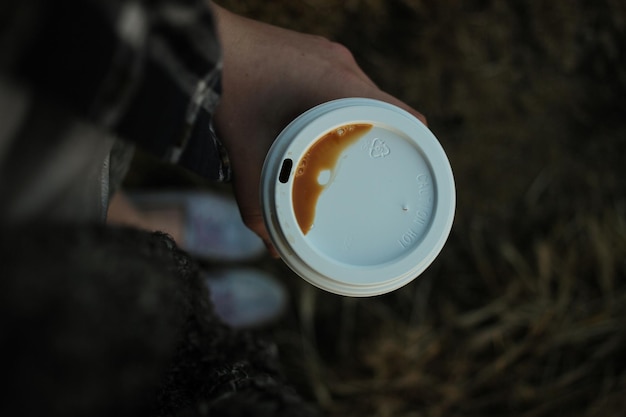 cropped hand holding coffee