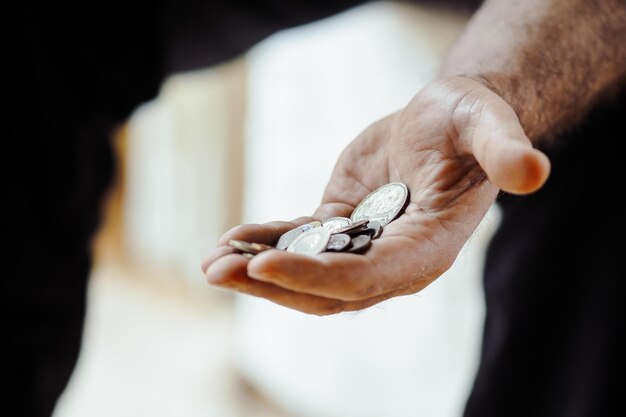 Photo cropped hand holding coins