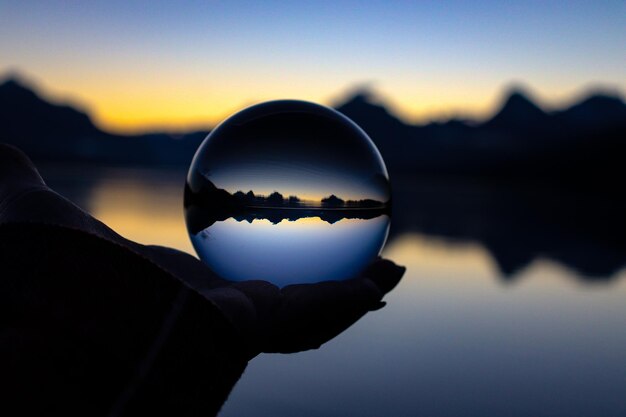 Photo cropped hand holding crystal ball