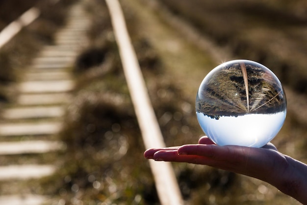 Photo cropped hand holding crystal ball