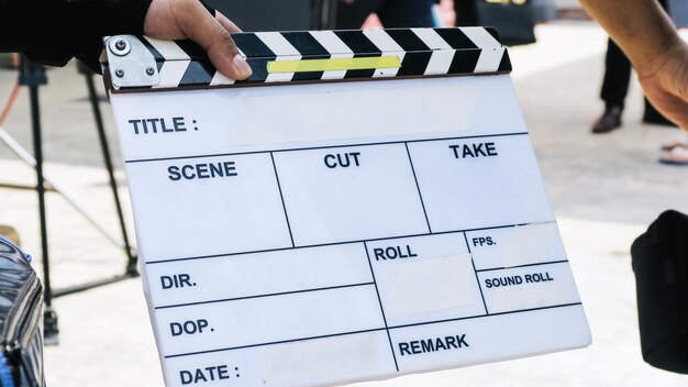 Photo cropped hand holding film slate