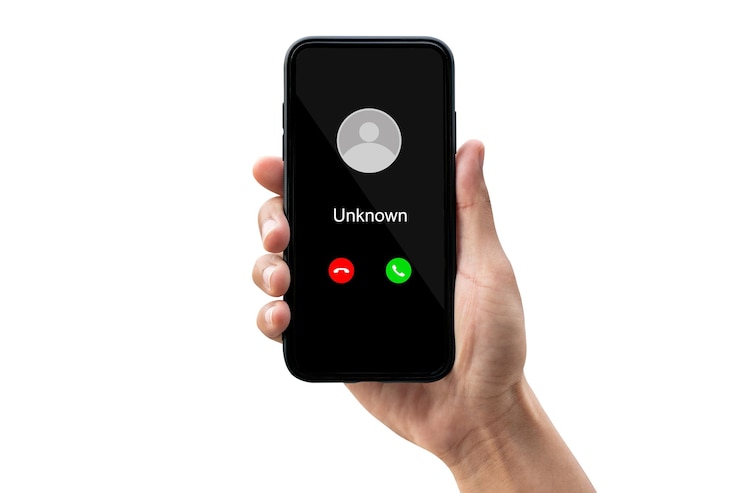 Photo cropped hand holding mobile phone against white background