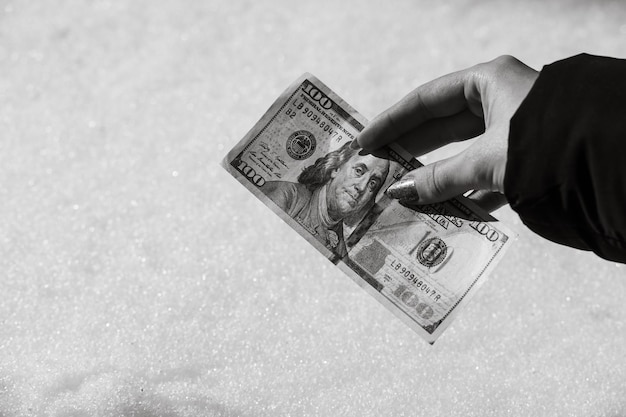 Photo cropped hand holding paper currency