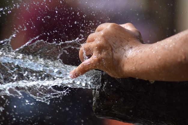 cropped hand holding pipe