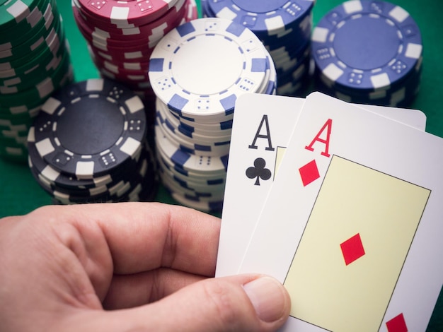 Cropped hand holding playing cards