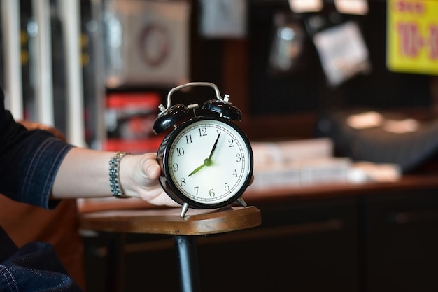 Photo cropped hand holding pocket watch