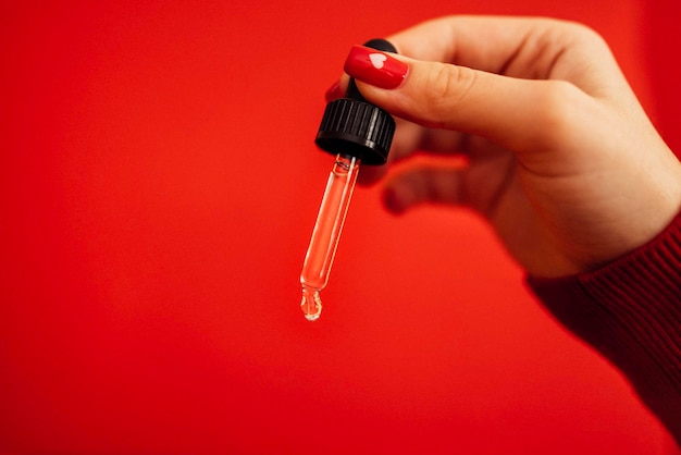 cropped hand holding thermometer
