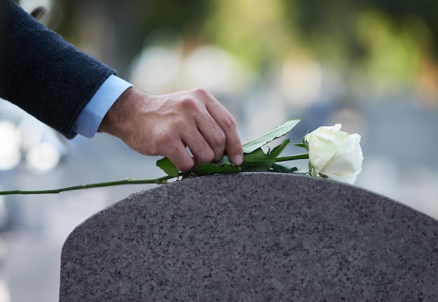 cropped hand of man holding bouquet