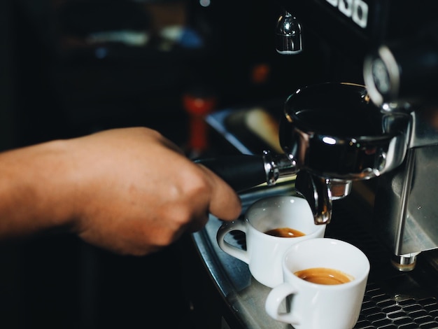 Cropped hand of man holding portafilter