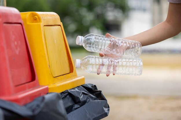 Cropped hand of person holding bottle