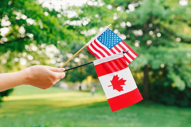 Photo cropped hand of person holding flags