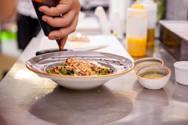 Cropped hand of person preparing food on table