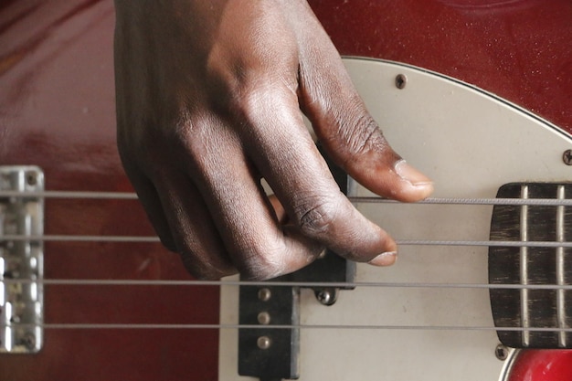 Photo cropped hand playing guitar