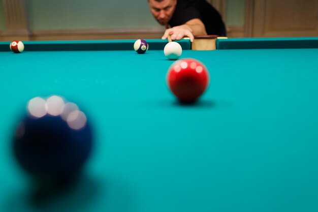 Photo cropped hand playing pool