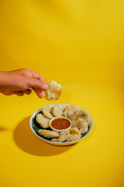 Cropped hand of woman holding cookies