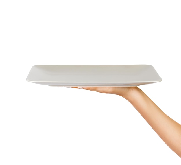 Photo cropped hand of woman holding empty plate against white background