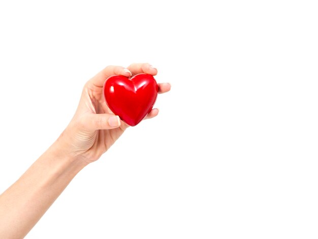 Photo cropped hand of woman holding heart shape against white background