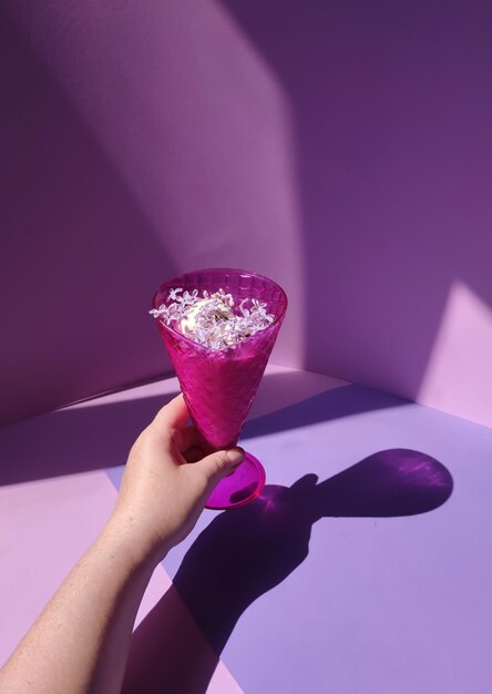 Cropped hand of woman holding strawberry