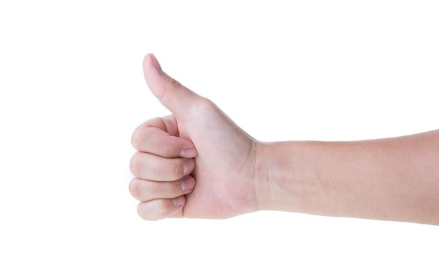 Photo cropped hand of woman making thumbs up gesture against white background