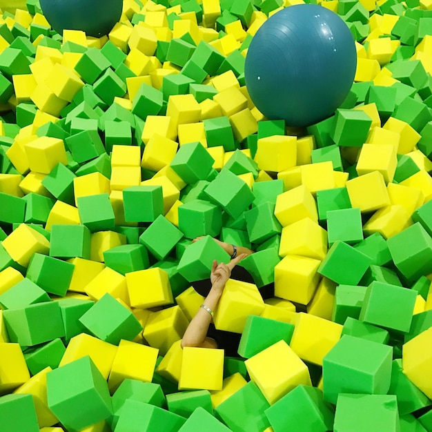 Photo cropped hands amidst toy blocks