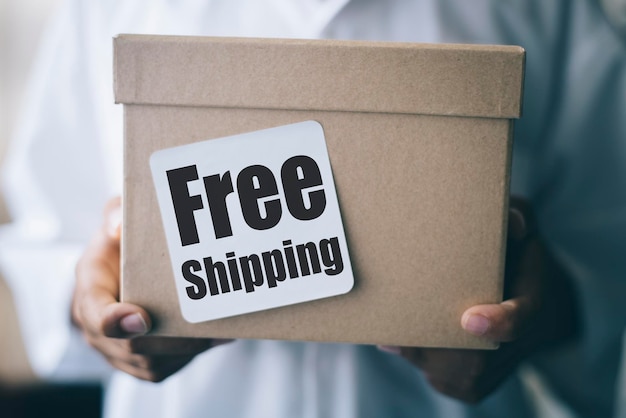 Photo cropped hands of boy holding cardboard box