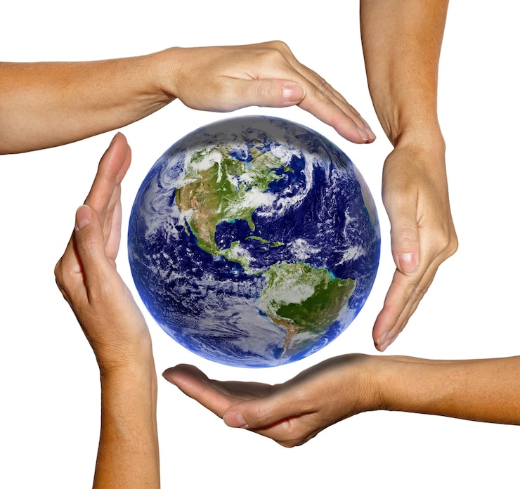 Photo cropped hands covering planet earth against white background
